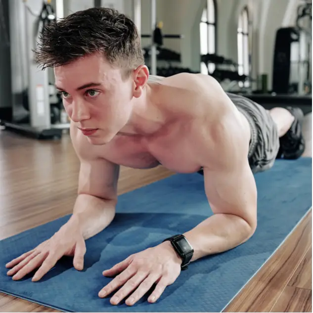 A man holding a plank  during High Intensity Interval Training