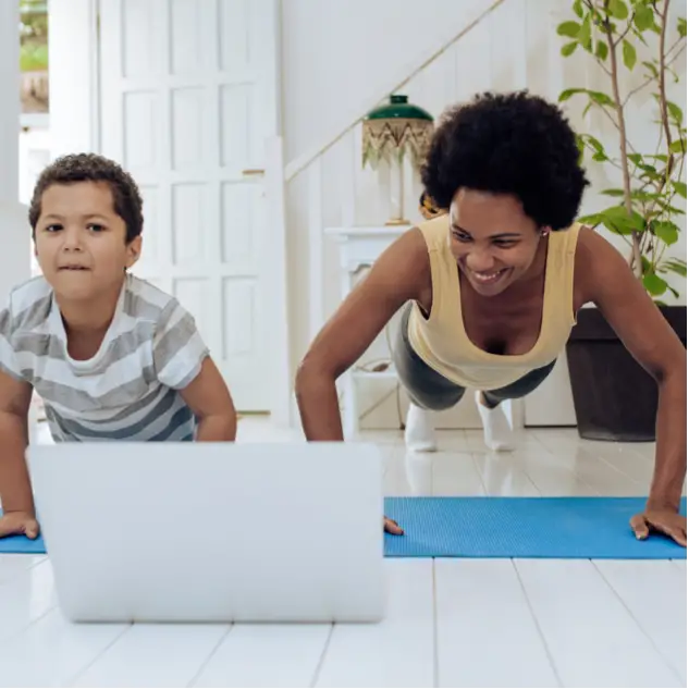 Mother and son doing a YouTube workout on demand